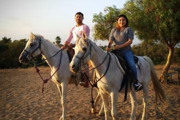 a couple on a romantic sweetheart horseback ride with sunshine and daydreams horseback riding in norco, california